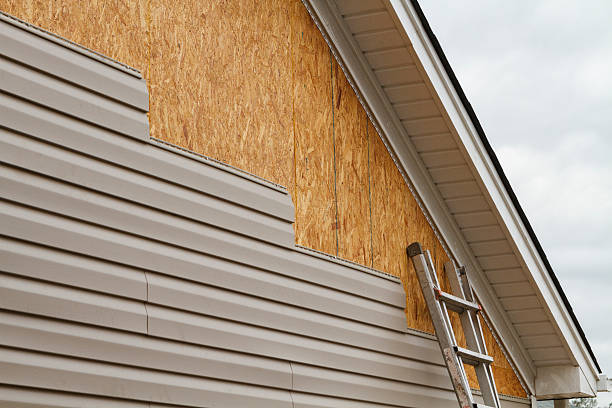Professional Siding Repair technician working in Island Park, NY